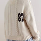 Cropped Cable-Knit 87 Graphic Sweater