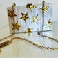 ESTRELLA chic White Clutch with Gold Star Accents